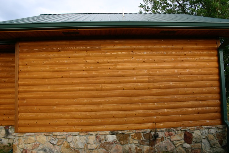 This photo shows the after staining of the same log wall.