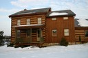 This is the finished log home after the corn cob blasting and stain were applied.