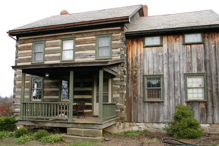 Here is a log home which also utilizes wood siding and the home is in need of blasting, preservative, and stain treatment.  It had been close to 20 years without stain.