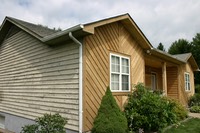 cedar sided home during media blasting